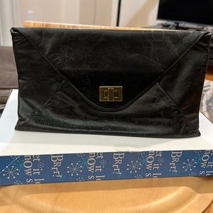 HOBO International black clutch in distressed leather.